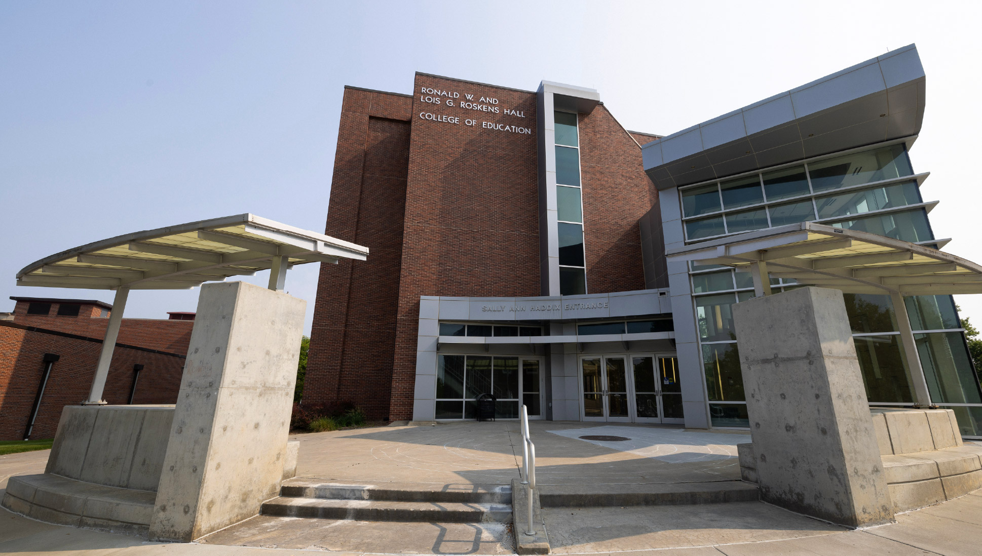 Exterior of Roskens Hall, College of Education building at the University of Nebraska at Omaha, showing the main entrance and modern architectural features.