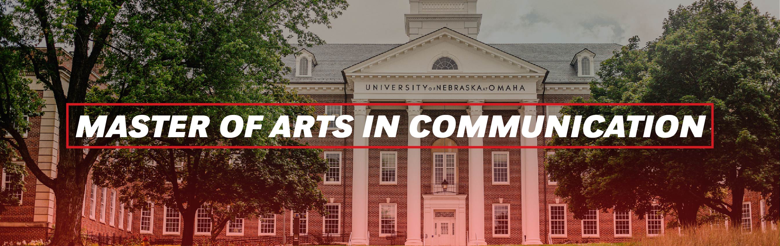 Front view of a classic brick academic building at the University of Nebraska at Omaha, framed by green trees. Bold white text in a red box overlay reads: “Master of Arts in Communication.