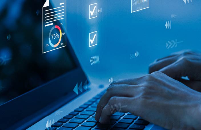 Close-up of hands typing on a laptop with digital charts and check marks overlayed, symbolizing flexibility, data analysis, and information systems tools.