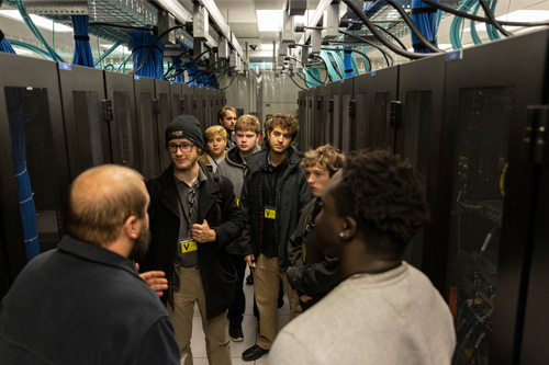 UNO students tour a server room during an internship