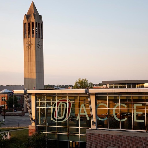 UNO library during sunset with the bell tower in the background