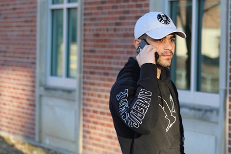 uno student talking on a mobile phone