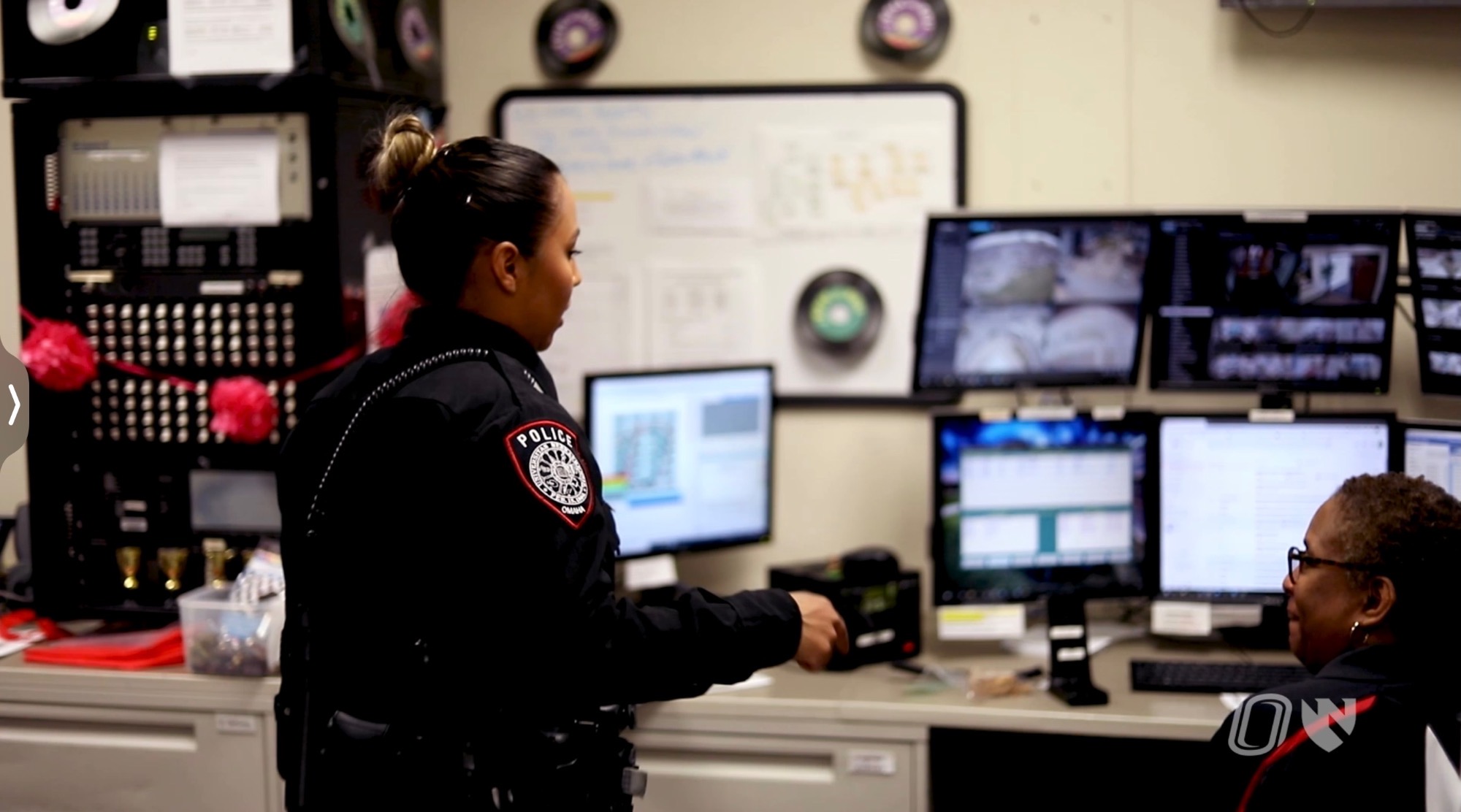 Campus police officer speaking with a UNO dispatcher
