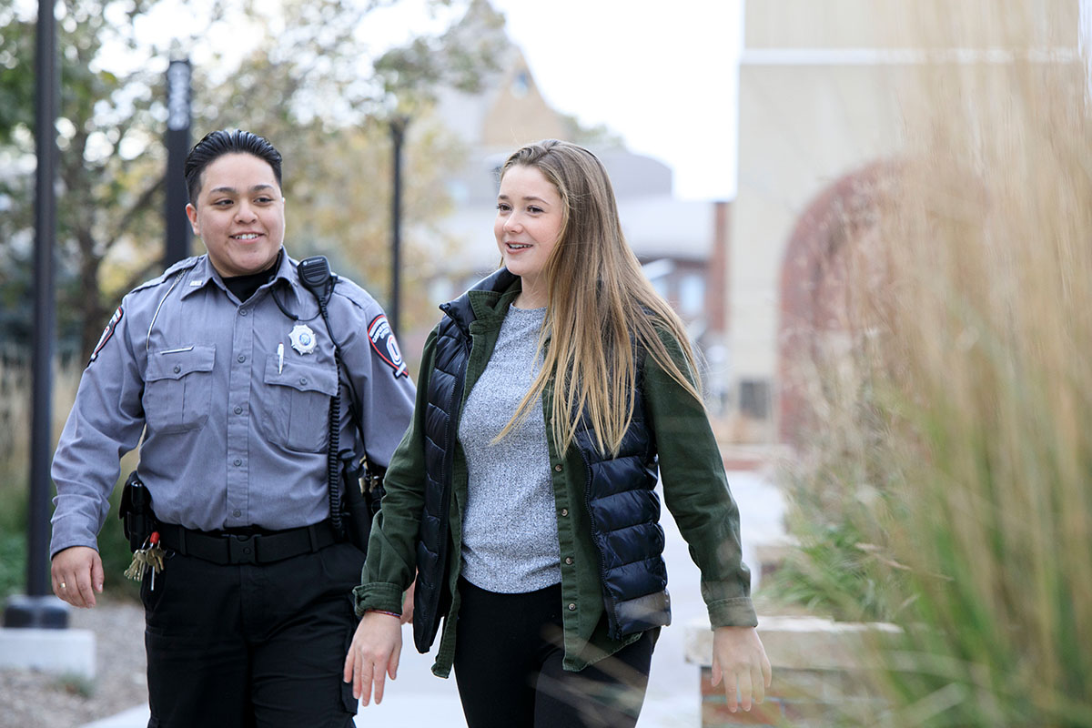 Campus Security Officer walking a student on campus