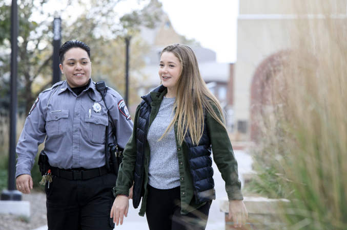 CSO walking student on North campus