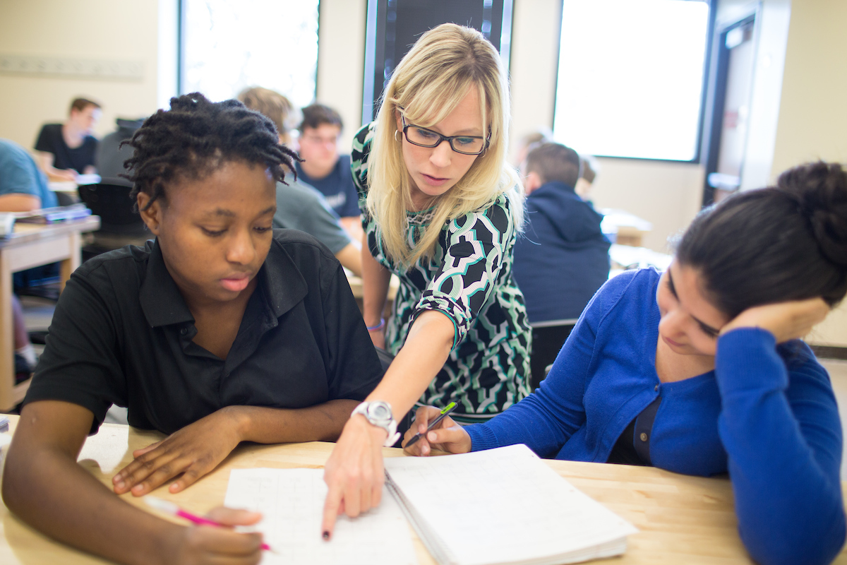 instructor guiding students in calculus course