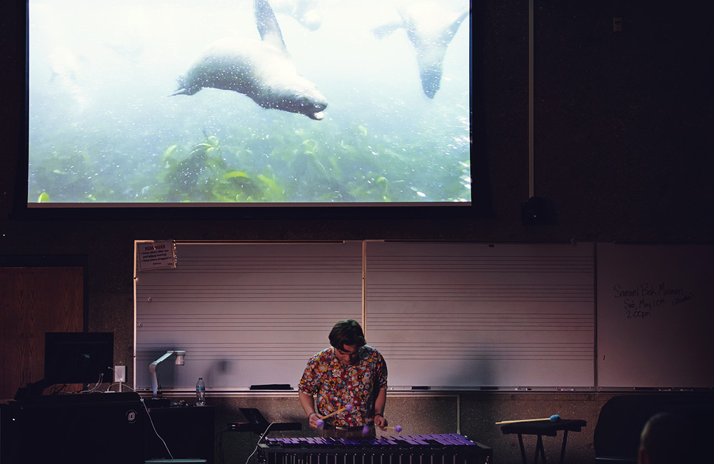Students view an aquarium exhibit during the research and creative activity showcase.