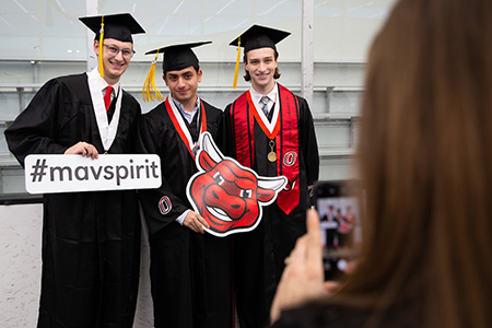 students in graduation gear