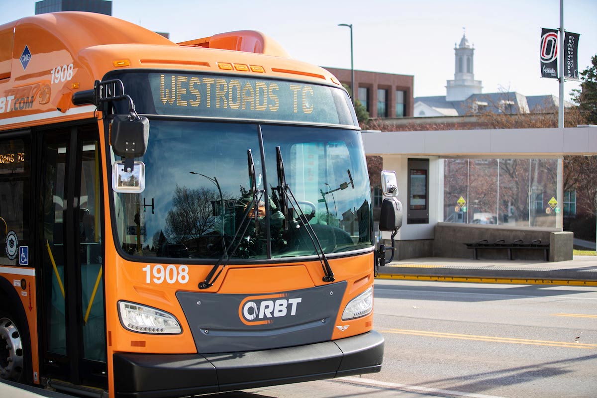 ORBT bus picks up passengers near UNO's student center.