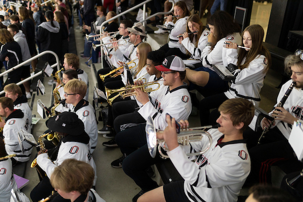 UNO Band members playing their instruments at the UNO Homecoming Hockey Game