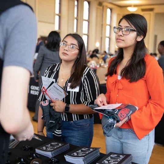 UNO students ask questions at an event.