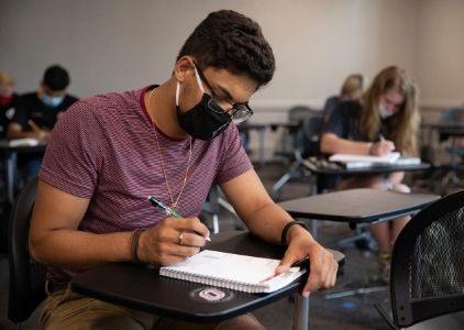 UNO students in classroom wearing masks.