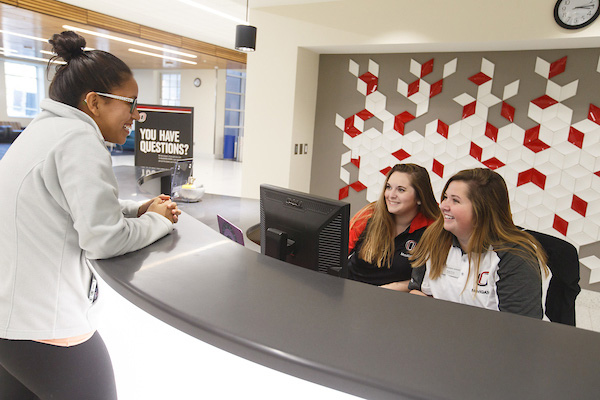 students helping a visitor