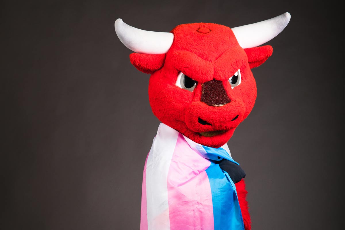 UNO's mascot, Durango, with a Transgender Pride flag