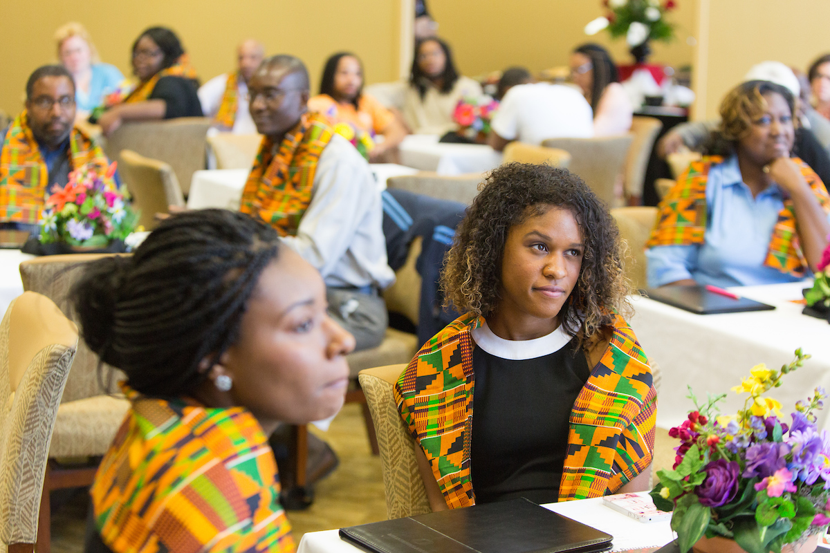Students attending Donning of the Kente, a graduation ceremony for African American students