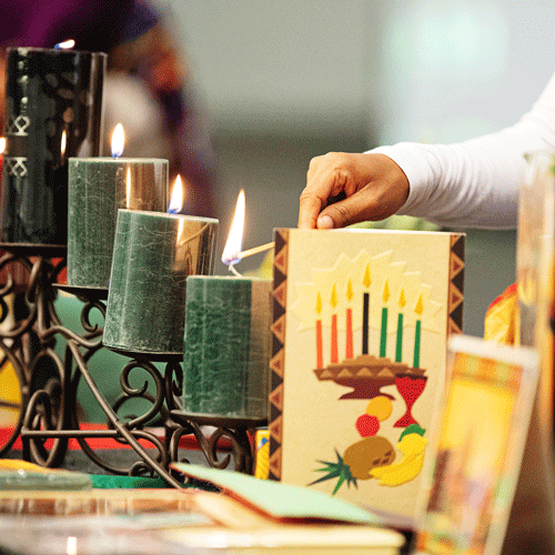 Lighting of Kwanzaa candles during a celebration at UNO