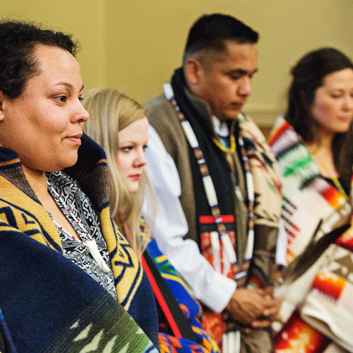 Native American students being honored during a graduation ceremony for Native students