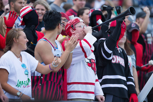 students cheer on the mavericks at a soccer game