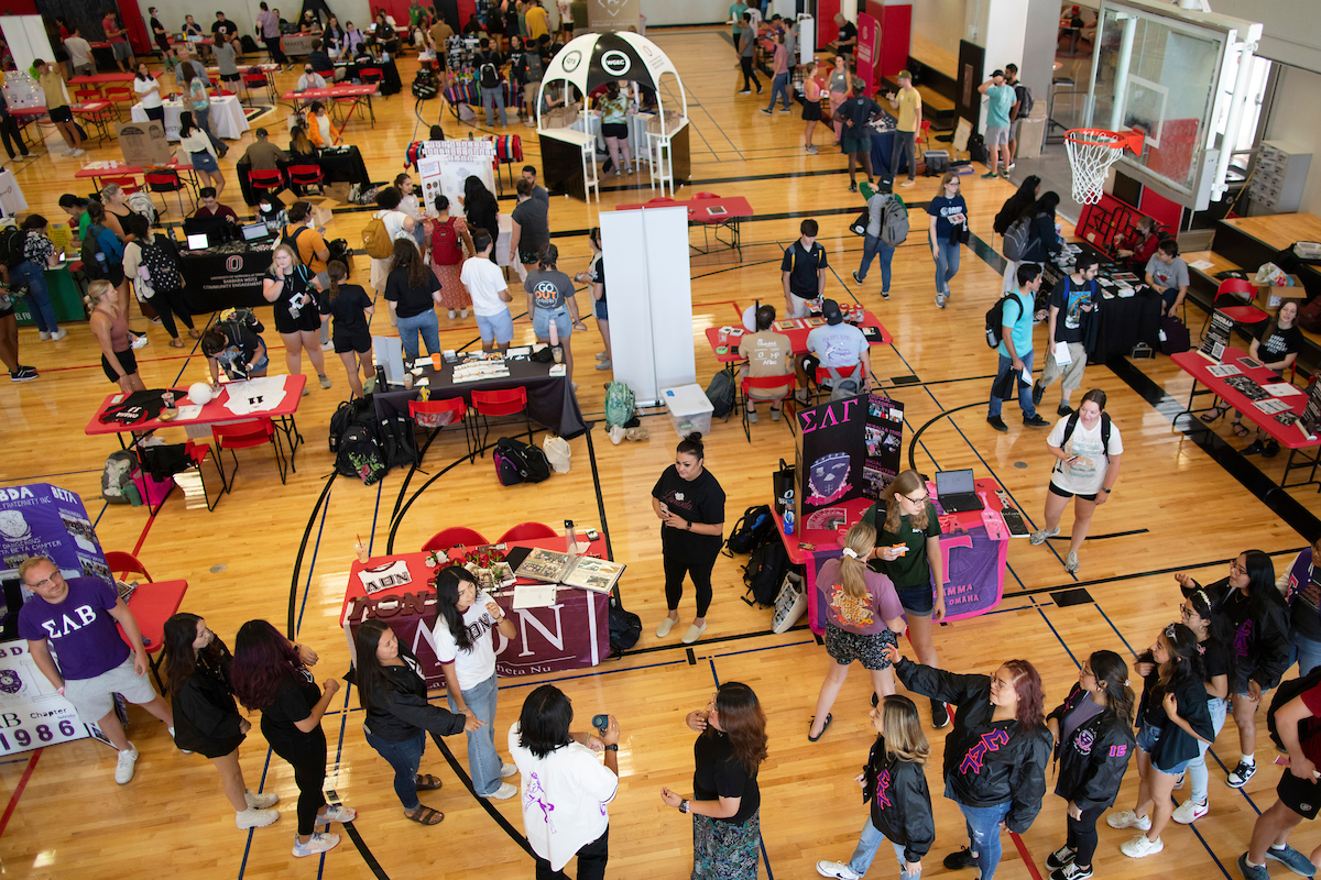 Student organization talking with a student.