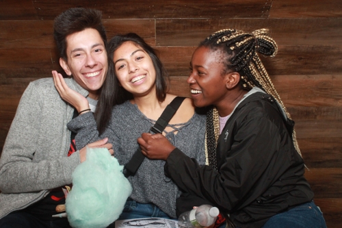 Three students posing for a photo at Block Party