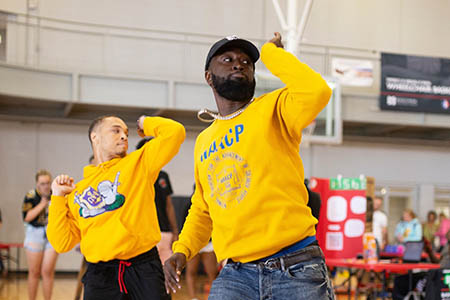 Members of Omega Psi Phi Strolling at the Involvement Fair