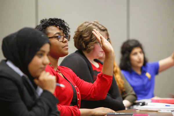 Student Government Senator votes during a meeting