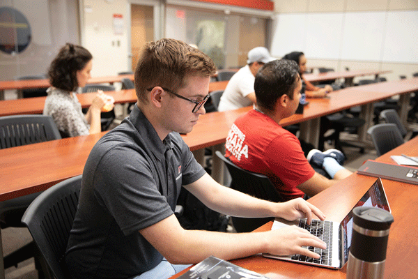 a member of student government, types notes as he and fellow students attend a Presidential listening session to give their thoughts on the search for a new president of the University of Nebraska system