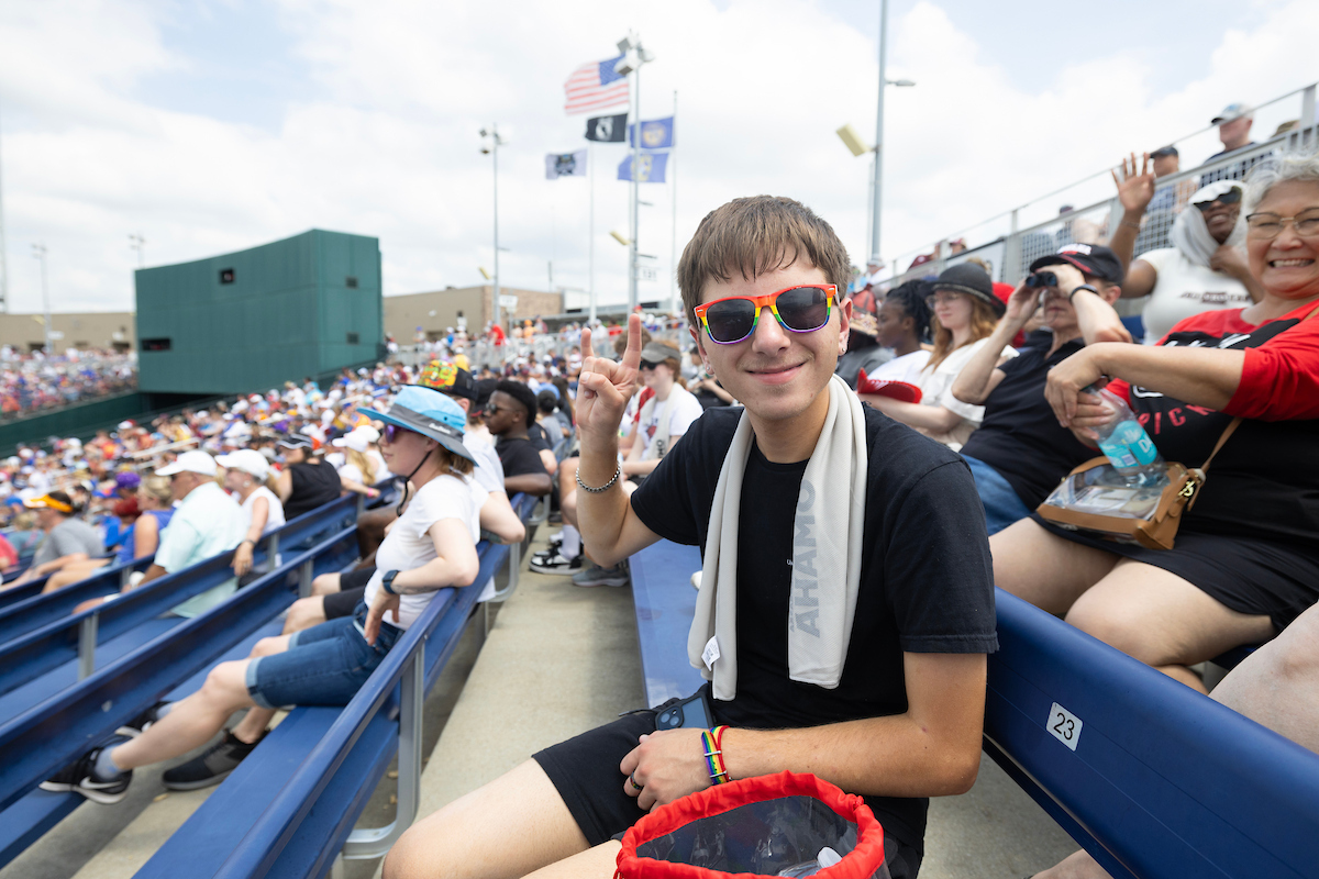Student enjoying the College World Series baseball game.
