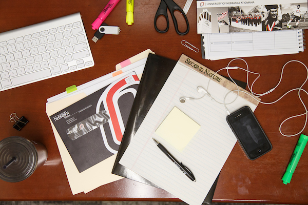 Desk with notepad and headphones