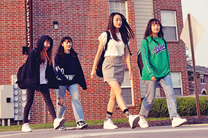 Group of students outside walking on campus