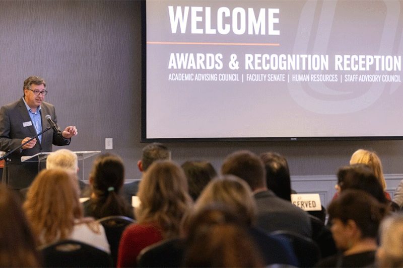 Kerry Fina presenting at the Awards & Recognition Reception 2024