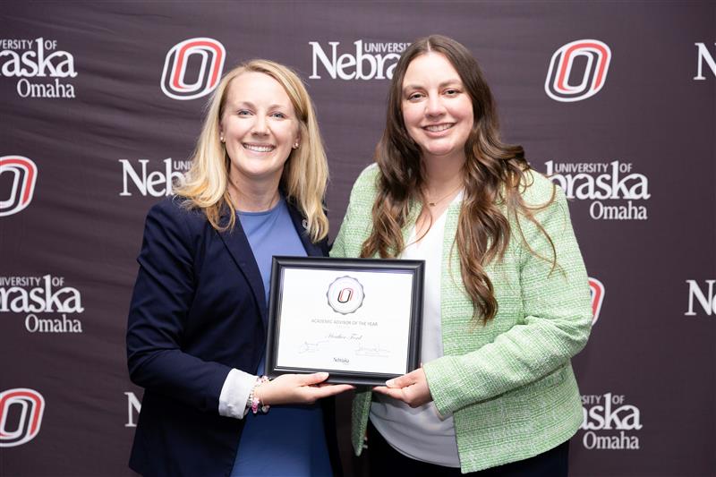 image of Heather Ford accepting her award for Advisor of the Year for the 2024-2025 year