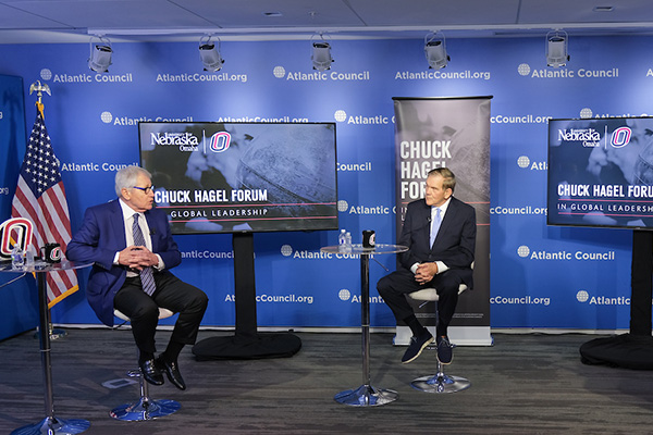 Michelle Black, Ph.D., an assistant professor of political science at UNO and a research fellow for the National Strategic Research Institute (NSRI), right, moderates a discussion between Former U.S. Secretary of Defense and UNO alumnus Chuck Hagel, left, and Former U.S. Secretary of Homeland Security Tom Ridge