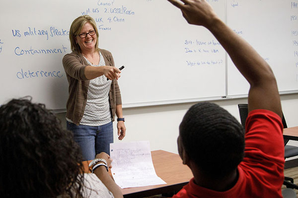 a professor speaks with students at the Nebraska Civic Leadership Program