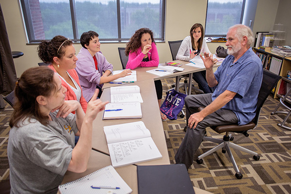 students learning american sign language in class