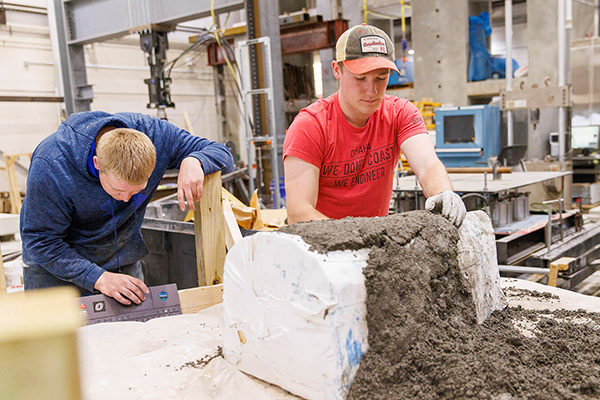 two students work in a construction lab
