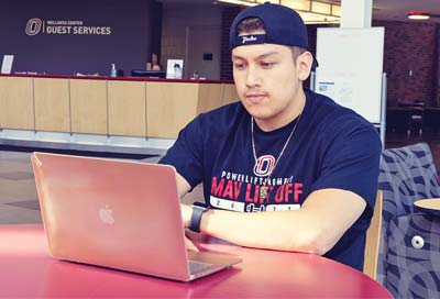 Student looking at laptop