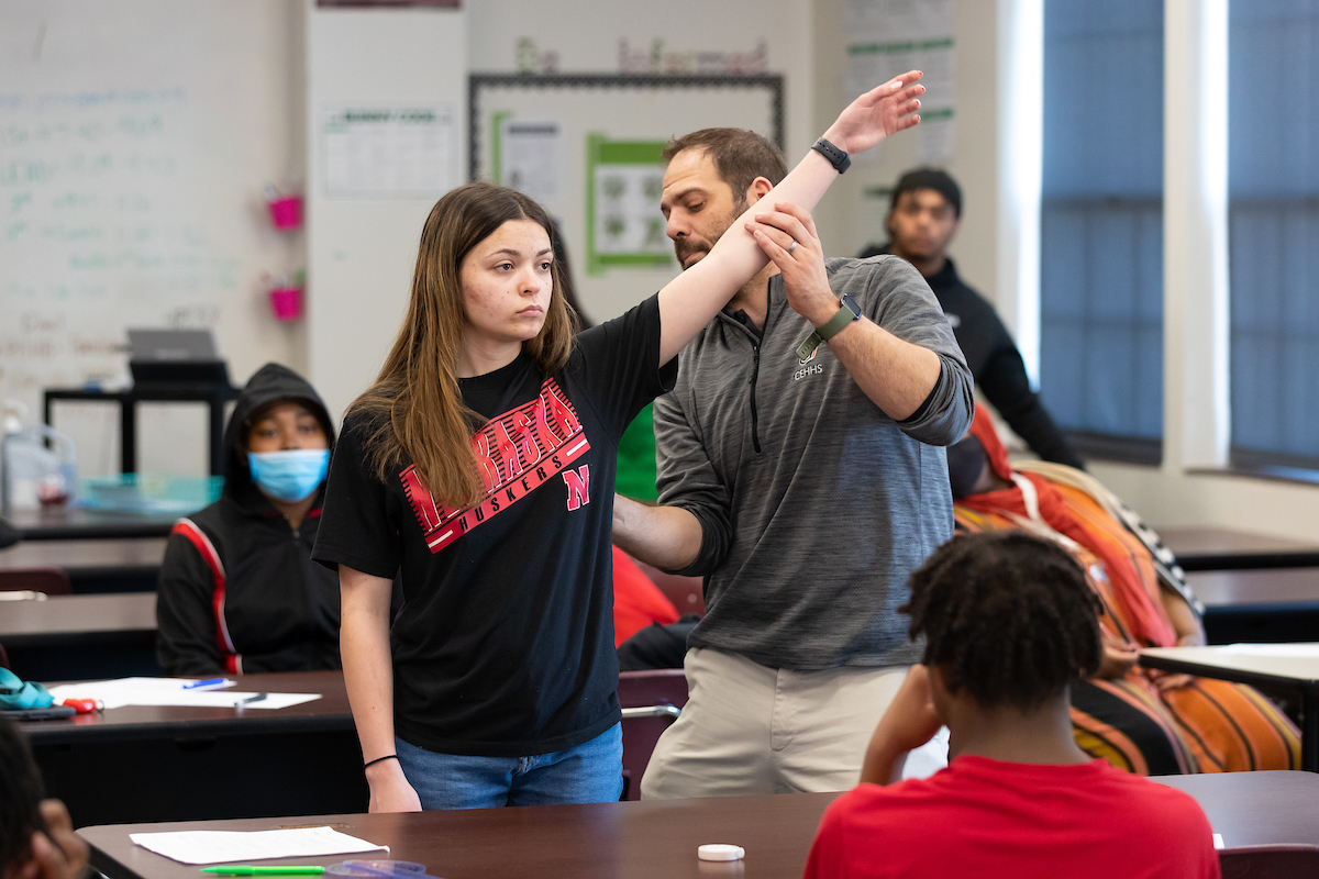 Benson alumna Anna Burk works with Dr. Adam Rosen