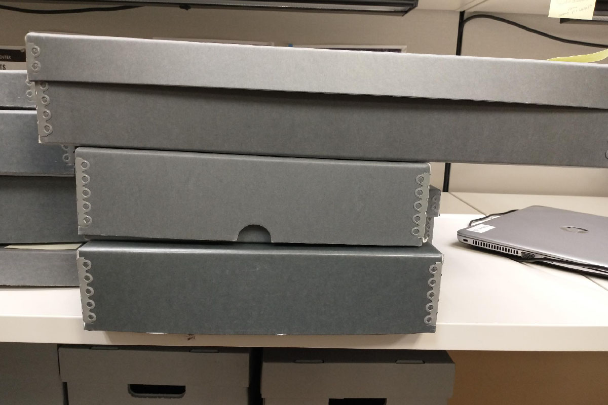 side vide of archival storage boxes stacked on one another 