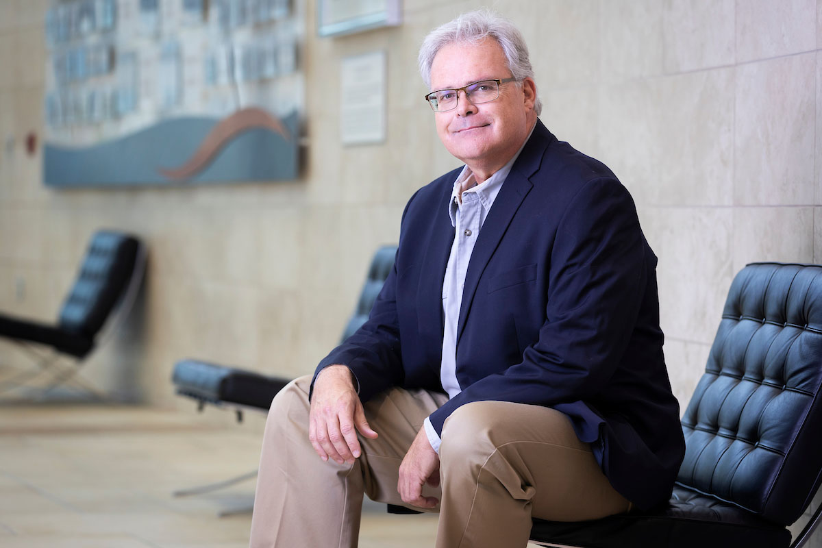 Christopher Decker, Ph.D., Lucas Diamond professor and professor of economics within UNO's College of Business Administration, poses for a portrait in Mammel Hall.