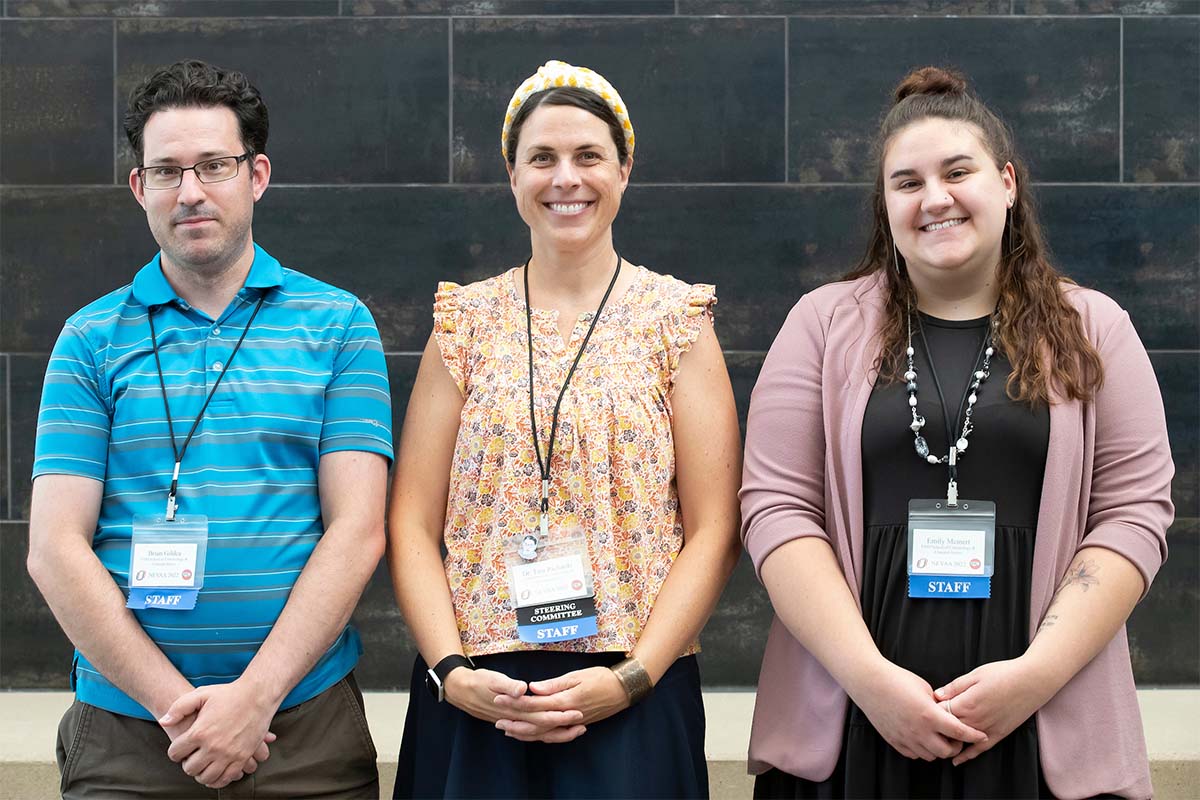 Tara Richards, Ph.D., associate professor of criminal justice at UNO (middle), led the effort to host NEVAA at UNO alongside graduate students Brian Gildea (left) and Emily Meinert (right).
