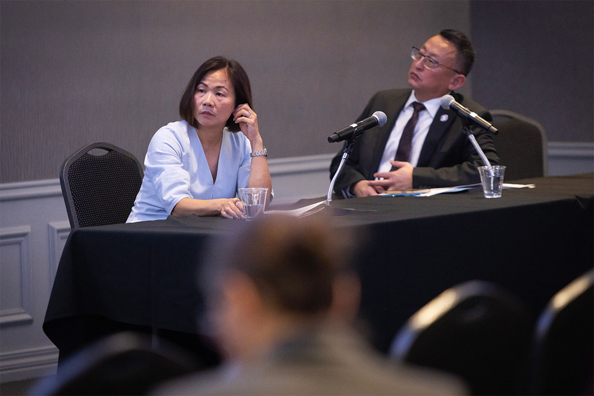 Chancellor Joanne Li, Ph.D., CFA, and Senior Vice Chancellor Phil He, Ph.D., listen during the budget town hall
