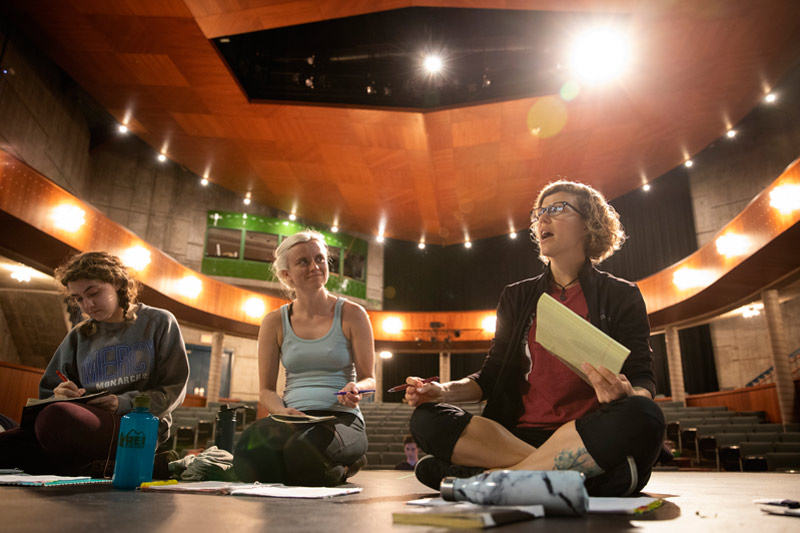 Brown reviews notes with the cast of "All's Well That Ends Well."