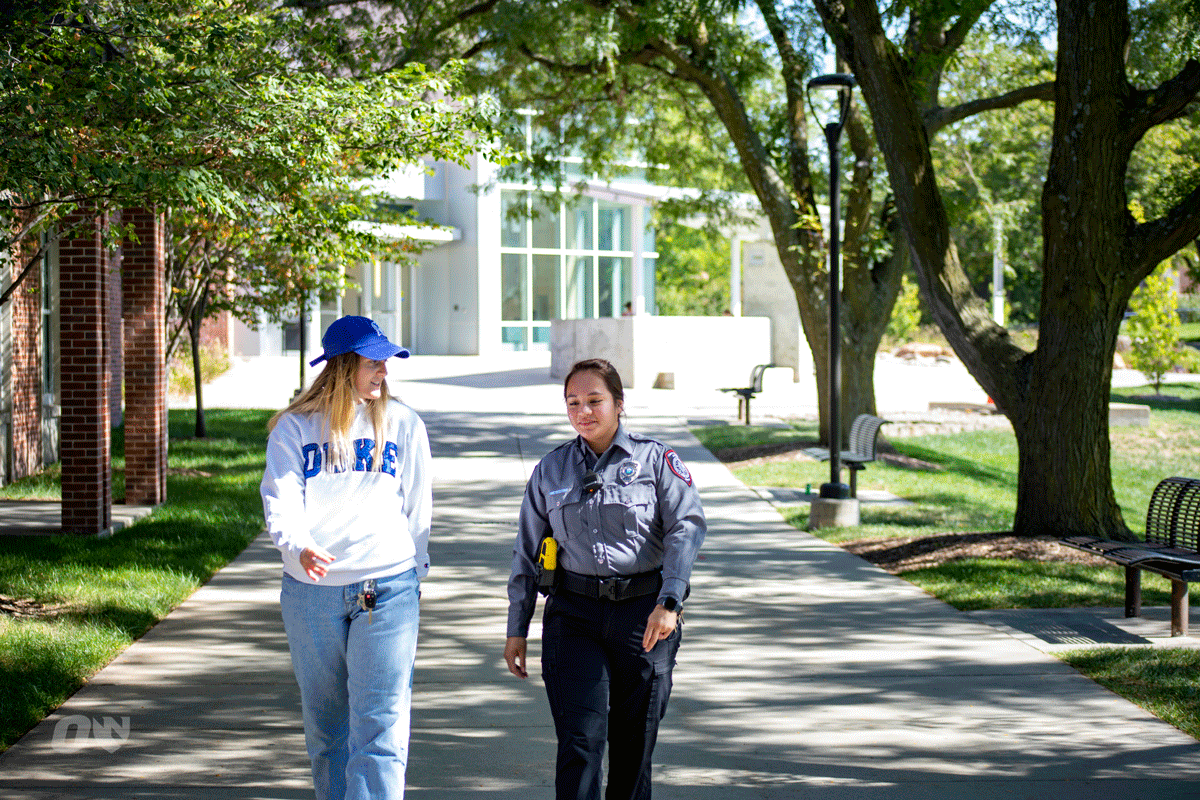 UNO campus security officer getting equipment out of the security vehicle